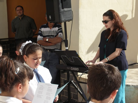 D1 Ms Mariella Spiteri plays the National Anthem