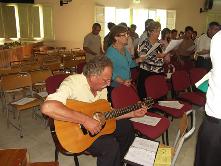 C9 Mario Xerri accompanying singing on guitar