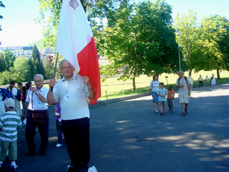 C5 Monty Sultana proudly holds the Maltese flag