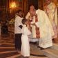 H3 Fr George Buttigieg gives Holy Communion to his nephew