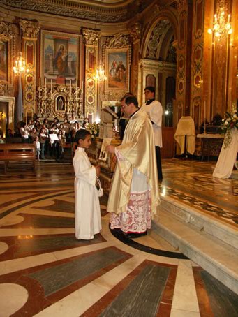 K8 Archpriest hands certificate of the occasion