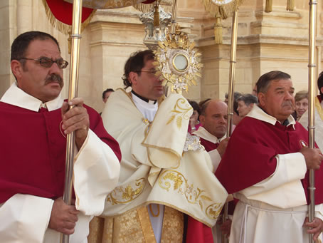 D4 Archpriest carries the Holy Eucharist