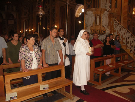 A2 Carrying a candle to the altar