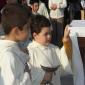 G2 Young altar boy holds the incense container