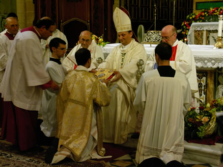 E7 Bishop hands Gospel to Deacon Farrugia