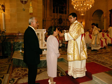 H8 Deacon Curmi gives Holy Communion to his parents