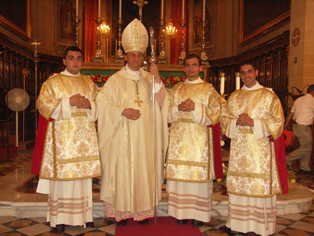 I7 Bishop Grech with the three Deacons