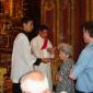 B2 Rev Anthony Bajada  distributiong Holy Communion