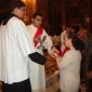 B1 Rev Joseph Curmi distributing Holy Communion