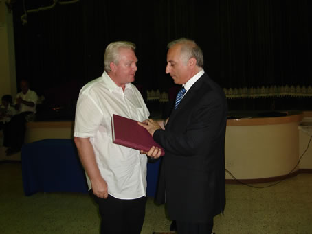 H2 George Hazzy presenting Webber's Songbook to Mro Jos Galea