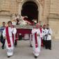 B6 Clergy carry the statue with relic