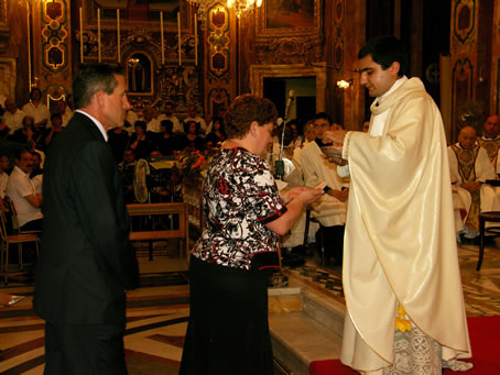 L1 Parents of Seminarian Mark Bonello receive Holy Communion