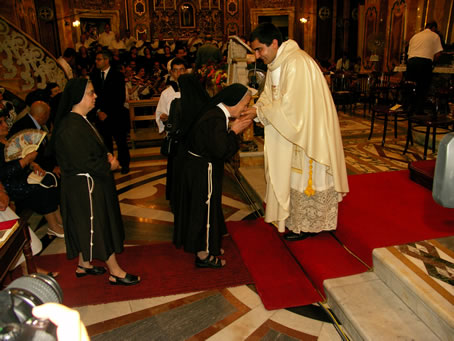 P1 Kissing the new priest's hands