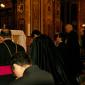 C8 Kneeling in front of the High Altar