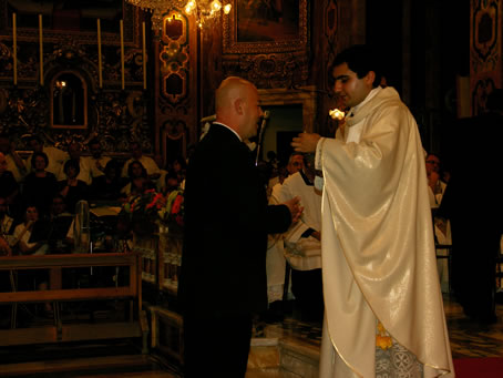 L3 Usher Tony Grech receiving Holy Communion