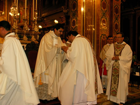 N4 Kissing the new priest's hands