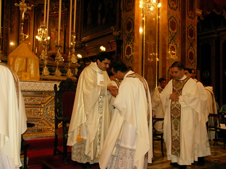 N3 Kissing the new priest's hands