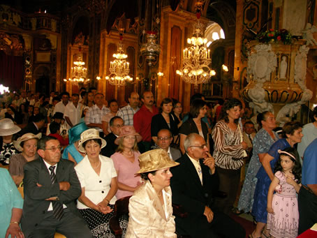 Q1 Queueing up to kiss the new priest's hands