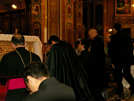 C8 Kneeling in front of the High Altar