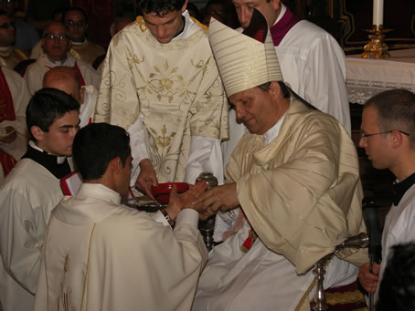 G1 Anointing hands of Fr Bajada