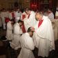 D7 Archpriest Can F Bajada lays hands on Fr Curmi's head