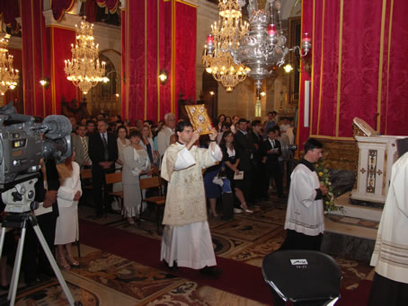 A4 Deacon Ant G Caruana leads the procession to the altar