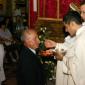 L5 Fr Bajada's father receives Holy Communion from his son