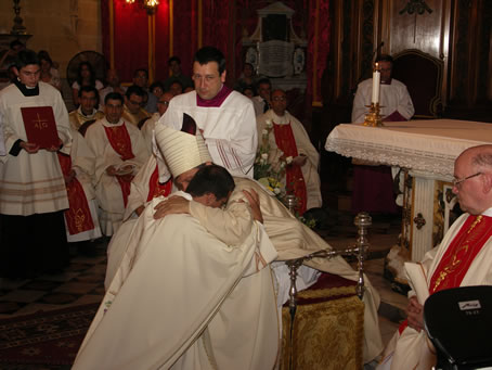 H4 Bishop embraces Fr farrugia