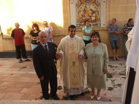 C4 Parents lead their son to celebrate Mass