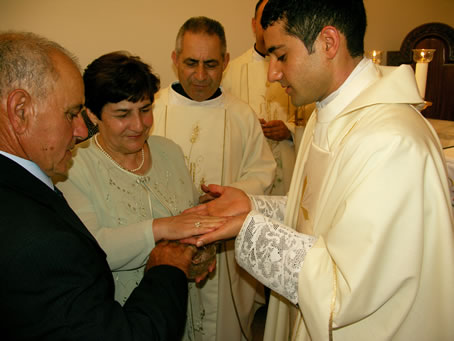 J3 Parents anointing his hands with balsam