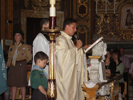 B6 Rover Scout Fr Jesmond Gauci reads the Gospel