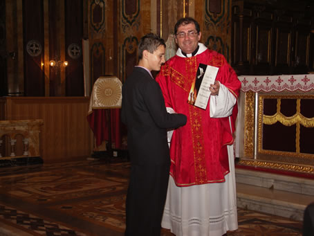 G3 Archpriest hands certificate of Confirmation