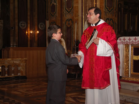 G2 Archpriest hands certificate of Confirmation