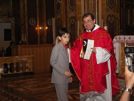 G1 Archpriest hands certificate of Confirmation