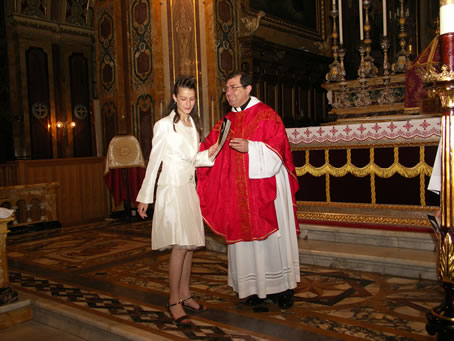 H3 Archpriest hands certificate of Confirmation