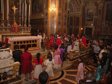 A1 Lighting candles from Pascal Candle held by Archpriest