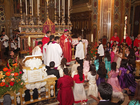 B3 Praying over the kneeling candidates