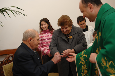 A3 Bride receives wedding ring from groom