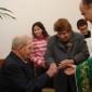 A3 Bride receives wedding ring from groom