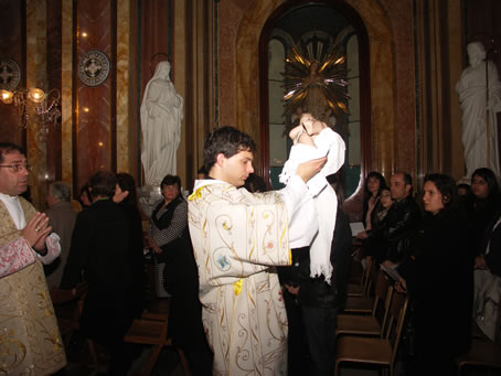 C3 Deacon carries Baby Jesus in procession