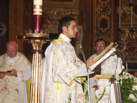 A7 Rev. Deacon Anthony Bajada reads the Gospel