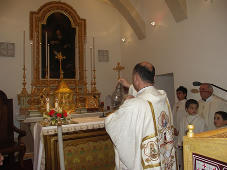 A8 Celebrant Can John Sultana incensing the altar