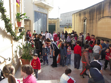 E8 Children gather in front of the Church