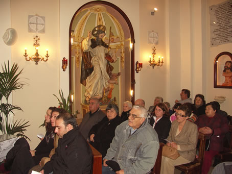 F7 Congregation in front of Niche with the Saint's Statue