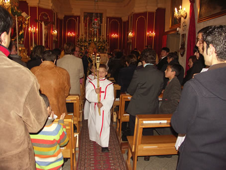 F65 Torch bearers move down the nave