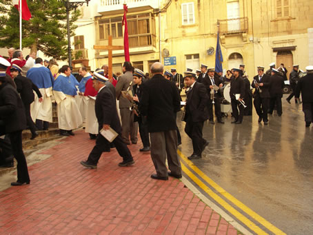 A6 Bandsmen, instruments and all retreat for shelter