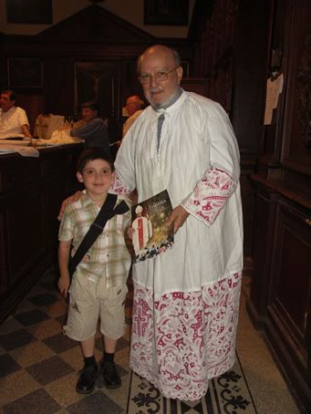 F1 Young boy receives magazine of Diocese of Garissa