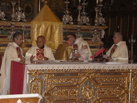 D9 Vicar General and Archpriest embrace in peace