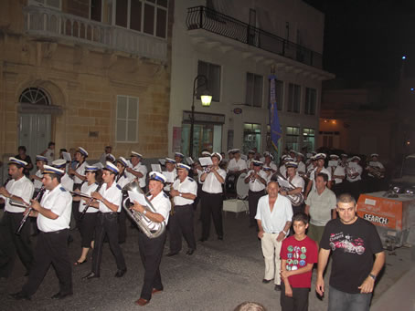 I9 Victory Band marches up 8th Sept Avenue