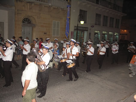 J1 Victory Band marches up 8th Sept Avenue